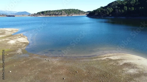 Aerial view of the Jarosa reservoir in Madrid, rising above its shore. Located in a beautiful natural environment of the Sierra de Guadarrama, travel, concepts, 4k resolution