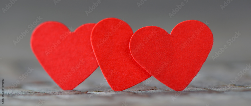 Obraz premium White and red heart on a wooden background.