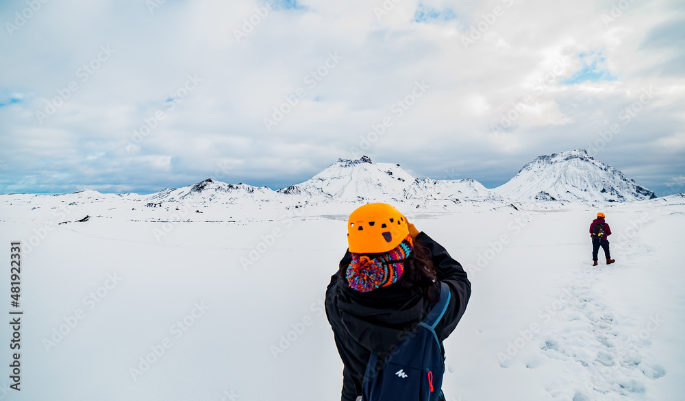Snow covered mountains in Iceland with group of Mountain Hikers