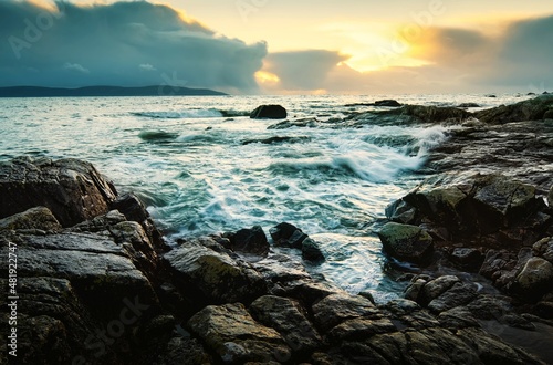 Beautiful sunset seascape scenery of rocky coast at wild atlantic way in Galway, Ireland 