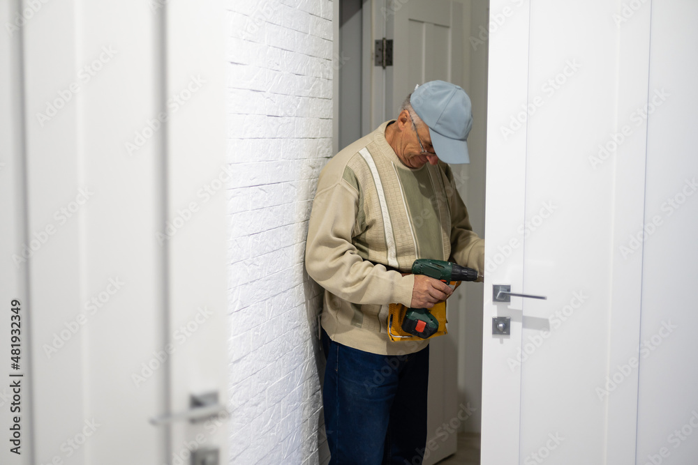 handyman repair the door lock in the room