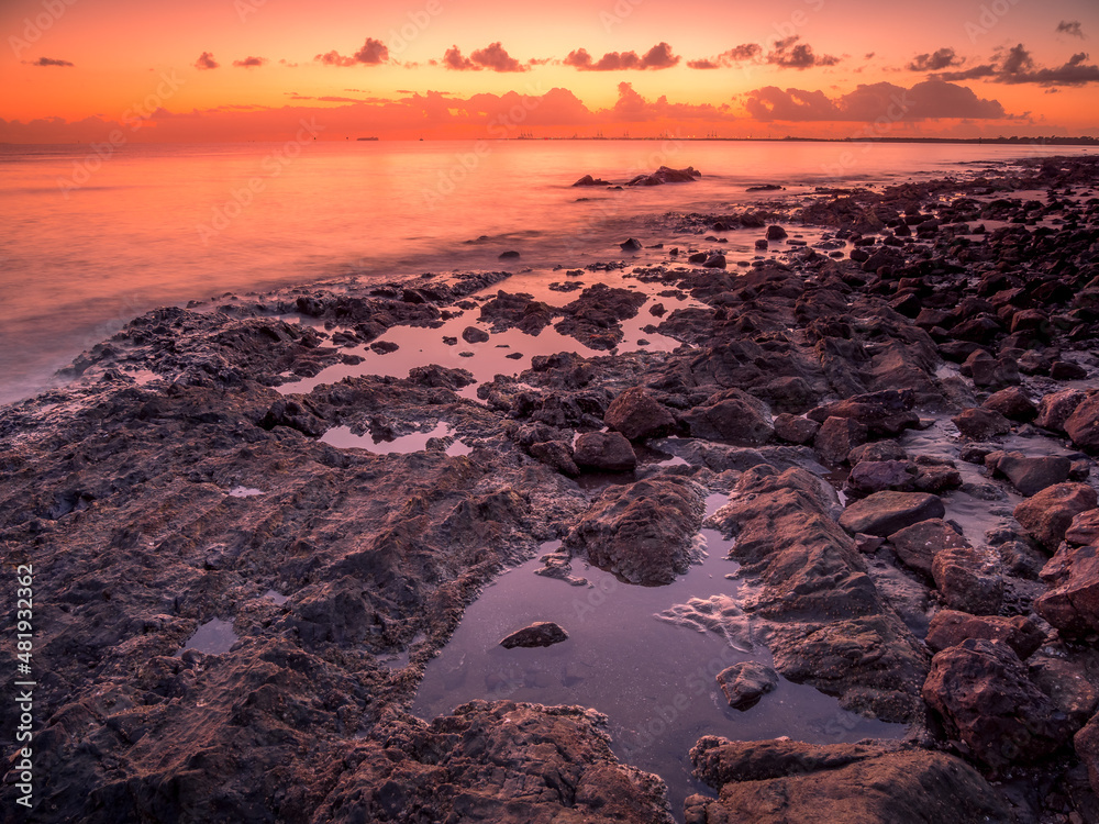 Seaside Sunrise with Rock Pool Reflections