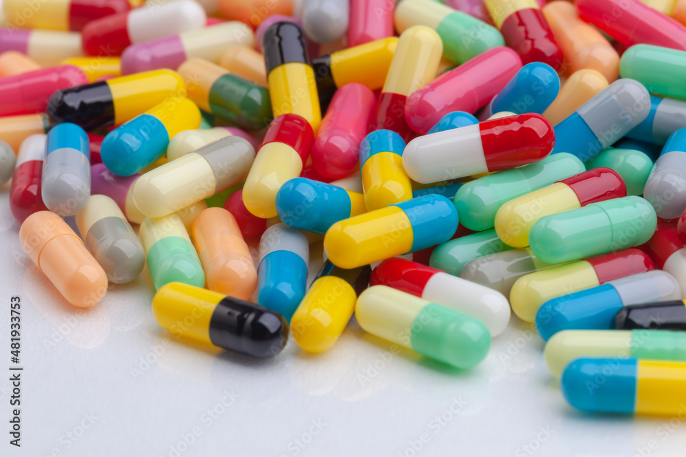 colorful pills on white background colorful pills on white background