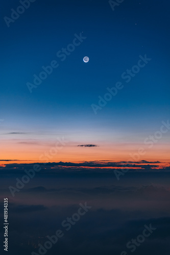 Crescent moon before the sunrise of 2022 at Tai Mo Shan, Hong Kong © KamWing