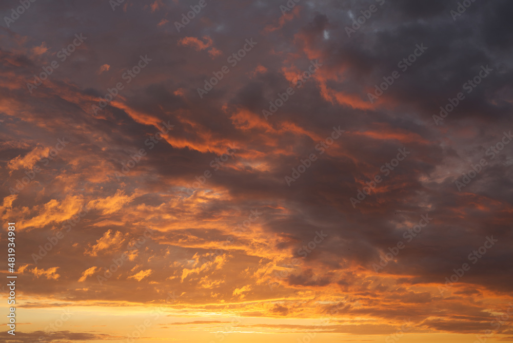 Dark orange red clouds with striking shades and a play of light