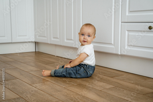 baby child sitting on floor © shamek