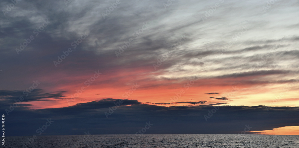 Sunset cloudscape. Light of nature colorful sky. Rjussia. Ladoga lake.