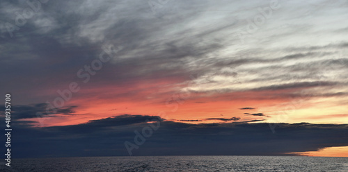 Sunset cloudscape. Light of nature colorful sky. Rjussia. Ladoga lake.