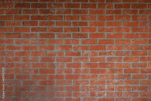 Old red brick wall texture background. Home or office design backdrop pattern.