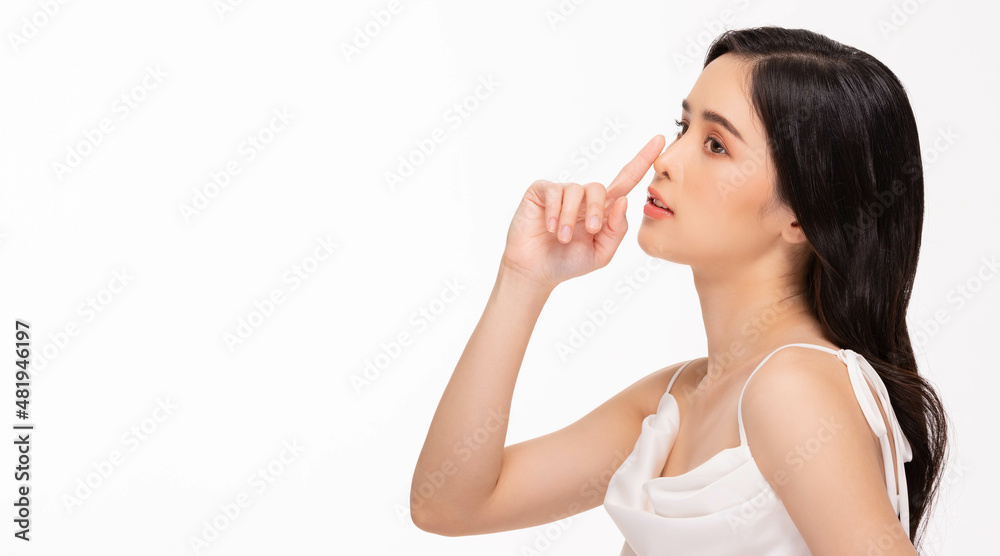 Beauty asian women touching nose portrait face with natural skin and skin care healthy hair and skin close up face beauty portrait.Beauty Concept on white background. Beauty asian women touching nose portrait face with natural skin and skin care healthy hair and skin close up face beauty portrait.Beauty Concept on white background.
