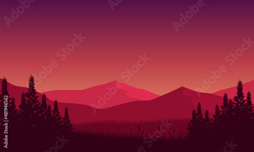 Fantastic mountain view with a forest at night from the out of the village