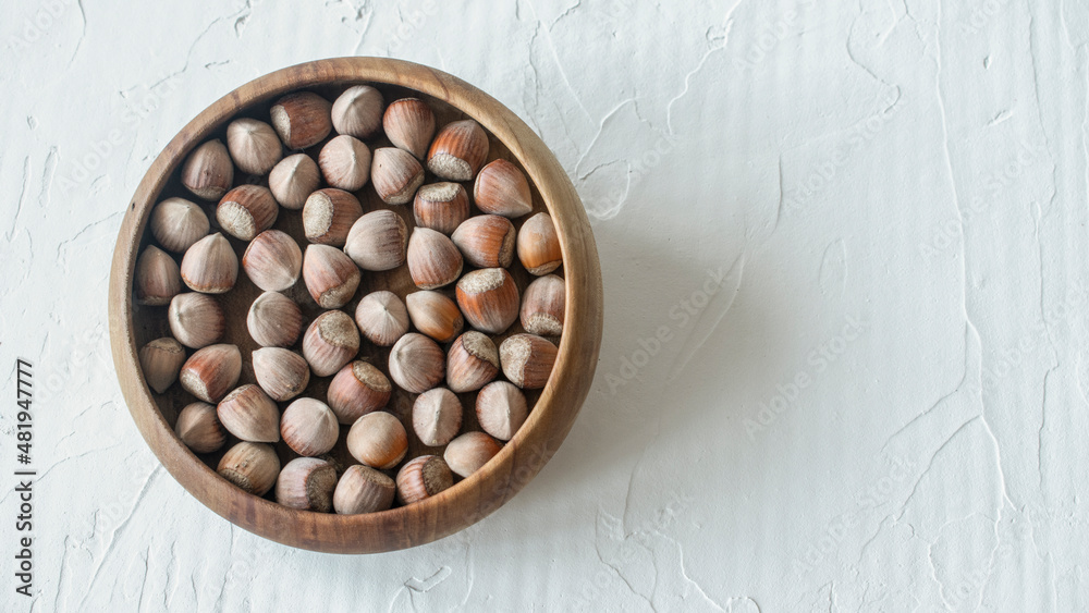 hazelnut in a wooden plate hazelnut in a wooden plate