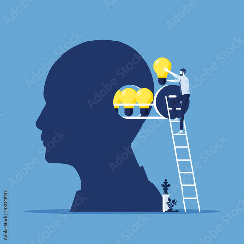 businessman insert light bulb of idea to human head, business creativity and innovation concept