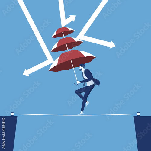 businessman crossing abyss on a high tightrope holding umbrella protecting himself from falling arrows, business protection crisis