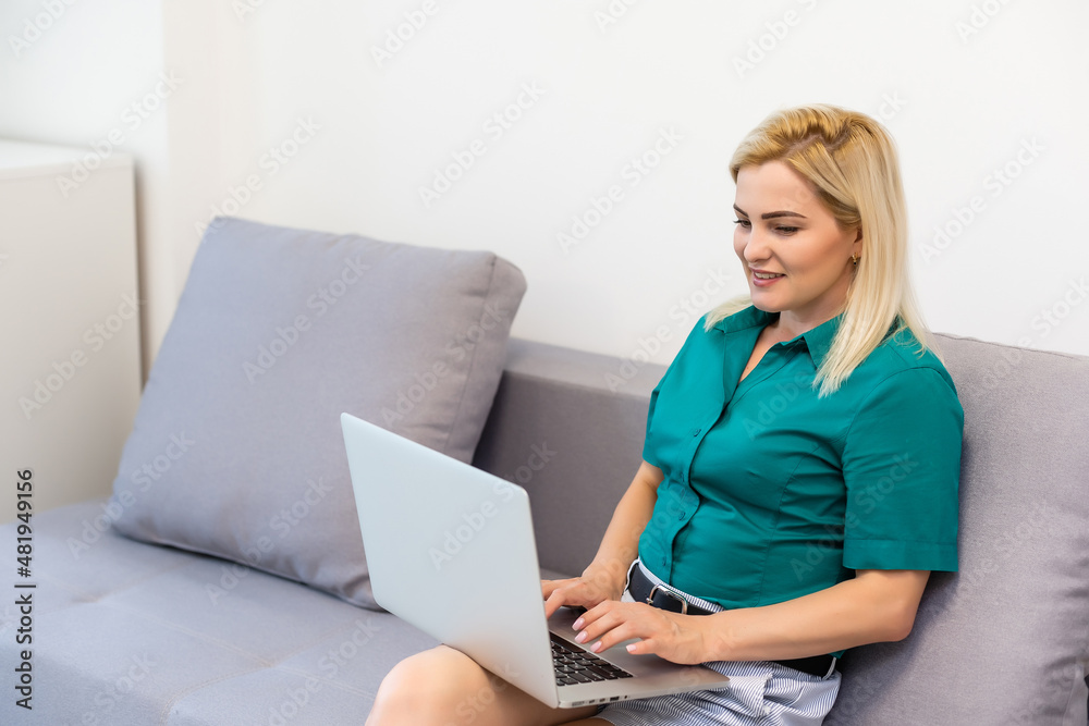 young beautiful woman using a laptop computer at home young beautiful woman using a laptop computer at home