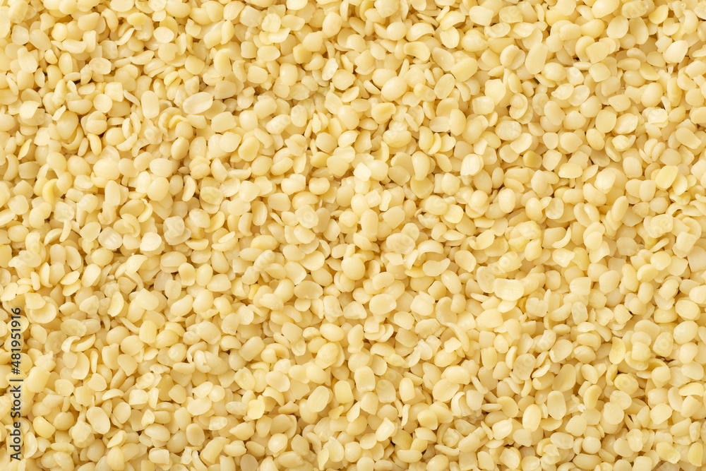 Hulled hemp seeds background, full frame, top view