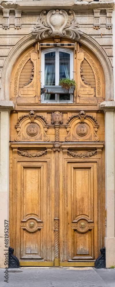 Paris, an ancient wooden door, beautiful facade in the 11e arrondissement
Paris, an ancient wooden door, beautiful facade in the 11e arrondissement