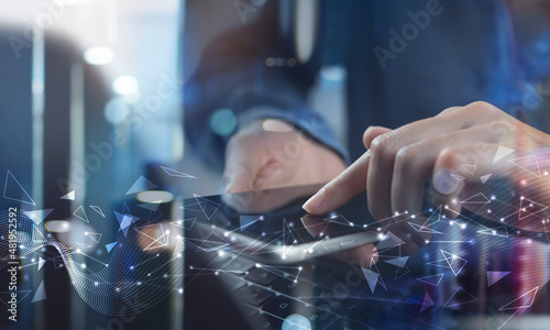 Digital technology, big data concept. Woman using mobile smart phone and laptop computer, abstract futuristic technology background