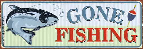 Vintage Gone Fishing metal sign. photo