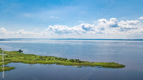 Dnipro river and green meadows aerial view from above, Dnieper river spring landscape, Ukraine 