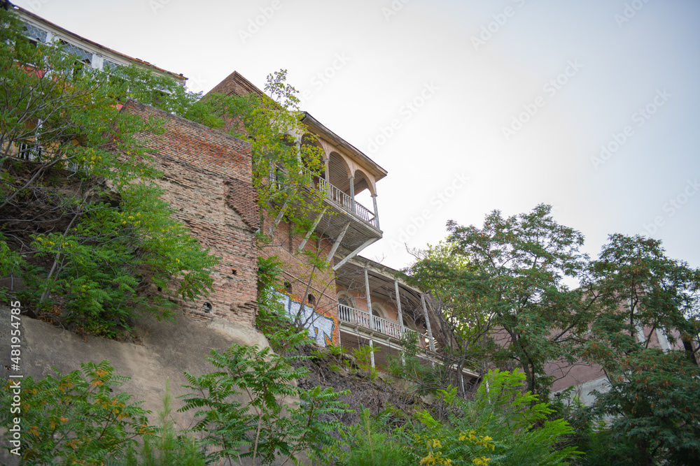 house with balconies on a rock in Tbilisi