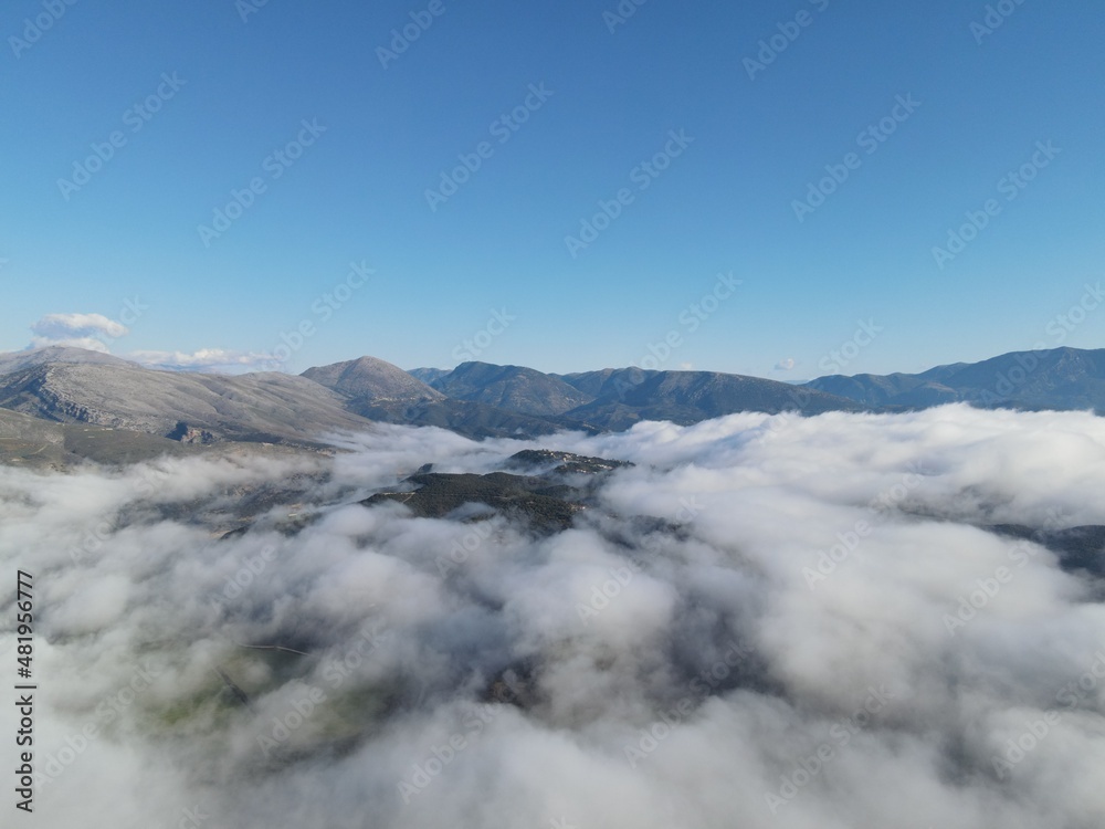 defauAerial View Massive Clouds Of Fog Above The valley Of Koritiani Village In thesprotia, Epirus, Greecelt