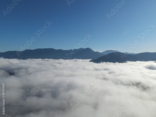 defauAerial View Massive Clouds Of Fog Above The valley Of Koritiani Village In thesprotia, Epirus, Greecelt