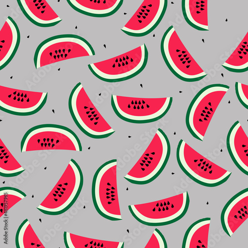 Fototapeta Naklejka Na Ścianę i Meble -  A simple pattern of watermelon. Gray background, juicy pieces of watermelon. The print is well suited for textiles,banners,Wallpaper and packaging.