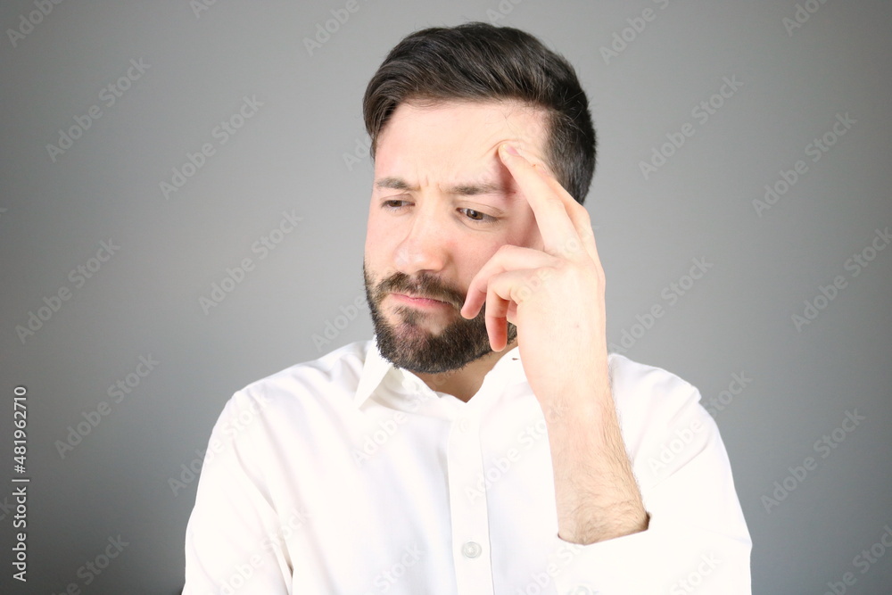 Young elegant man thoughtful expression Young elegant man thoughtful expression