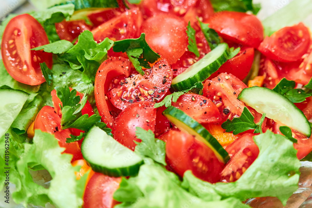 Bright, fresh vegetable salad. Cucumbers and tomatoes Bright, fresh vegetable salad. Cucumbers and tomatoes