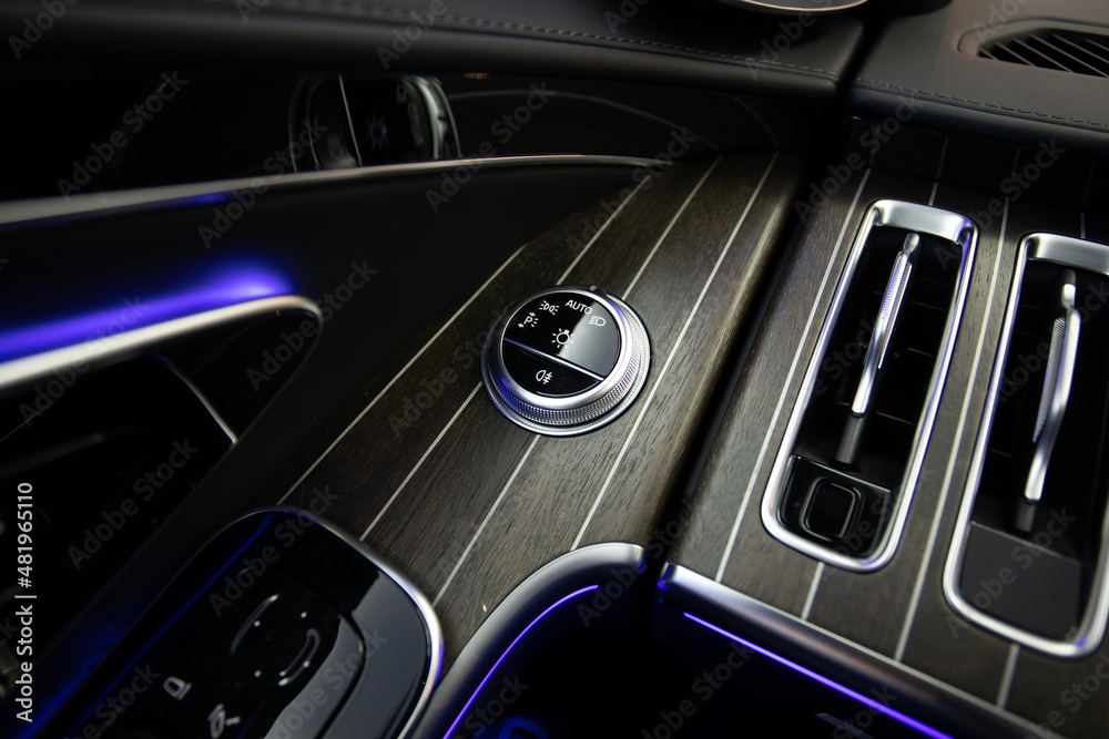 Headlight light switch in luxury car interior Headlight light switch in luxury car interior