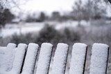 Snowy wooden fence