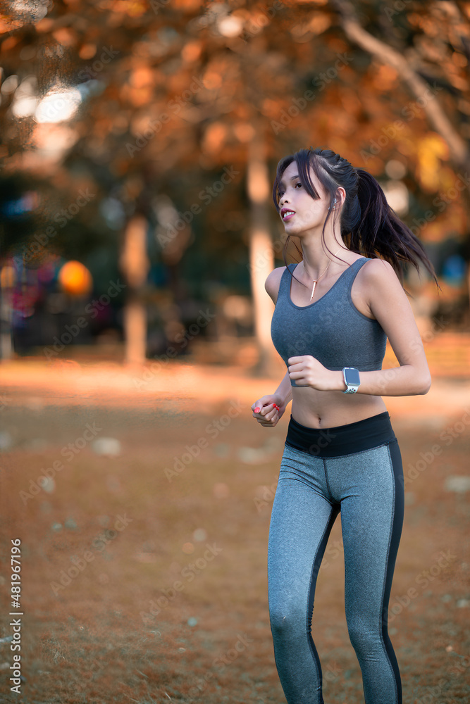 Young and beautiful asian woman exercising at the city park. Relax and fitness training concept. Young and beautiful asian woman exercising at the city park. Relax and fitness training concept.