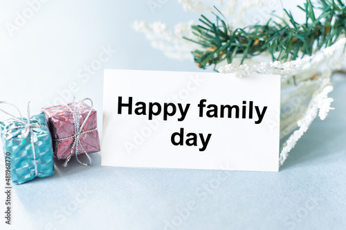 Happy family day text on a card on a festive background
