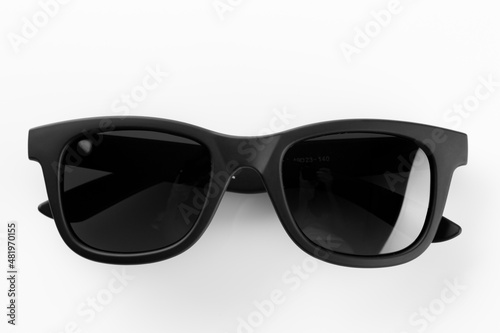 Sunglasses in a black frame on a white background.