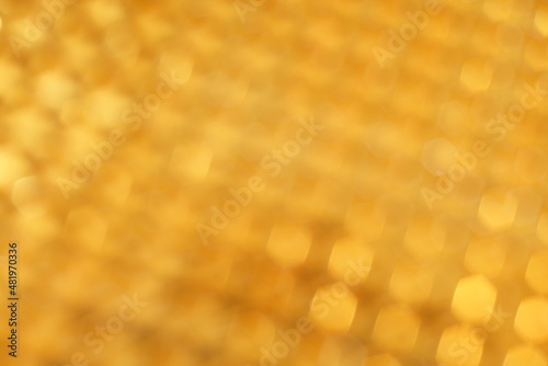 Goldene Textur mit sich wiederholenden, regelmäßigem Raster in perspektivischer Sichtweise für festliche Gelegenheiten wie Weihnachten oder Goldene Hochzeit photo