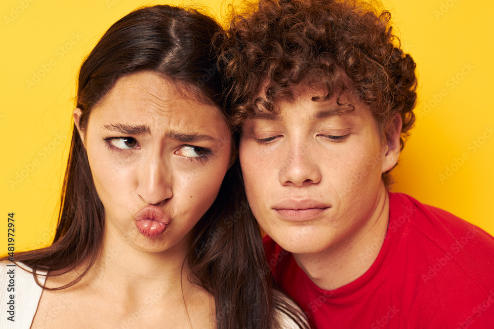 teenagers Friendship posing hugs together yellow background unaltered teenagers Friendship posing hugs together yellow background unaltered