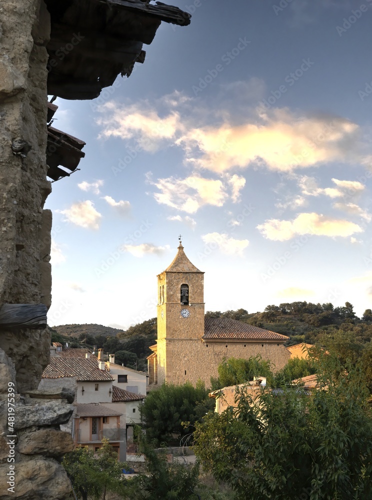 Las Parras de Castellote with its parish church of San Nicolas of Bari, beautiful village in the interior and rural Spain in Bajo Aragon, Spain.