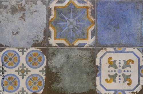 Tile texture on the wall. Decorative insert. Mosaic art. Roman style. Architectural tile insert