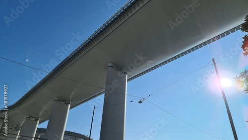 Genova, Italy- January 20, 2022: Beautiful viiew to the new bridge of Genova froom the bottom. Modern construction. Ponte San Giorgio with blue sky in the background.