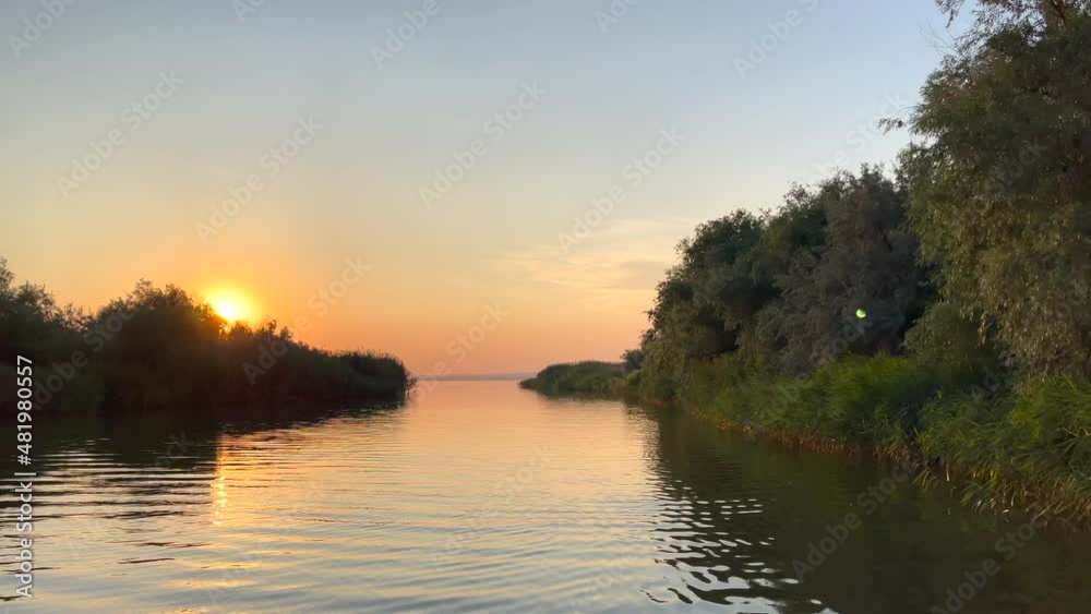 4k video with a boat in move on a beautiful lake during an amazing sunset. 4k video with a boat in move on a beautiful lake during an amazing sunset.