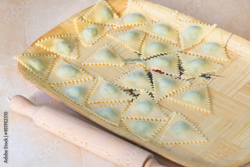 Italian pasta. Tortelli with spinach and ricotta in a tray  photo