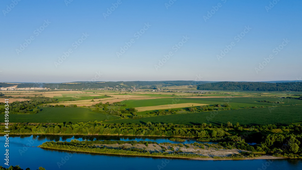 Stunning top view of the sinuous Dniester River. Summer landscape of the Dniester River. Picturesque photo wallpaper. Discover the beauty of earth