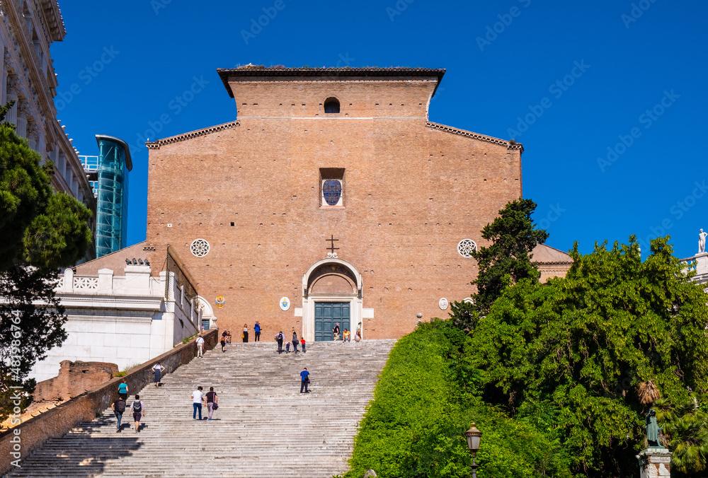 Basilica of St. Mary of the Altar of Heaven, Santa Maria in Ara Coeli with monumental stairs at Campidoglio Capitoline hill in historic city center of Rome in Italy