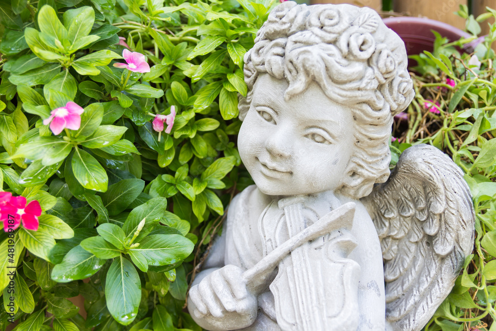 Close up view of a sculpture angel in garden