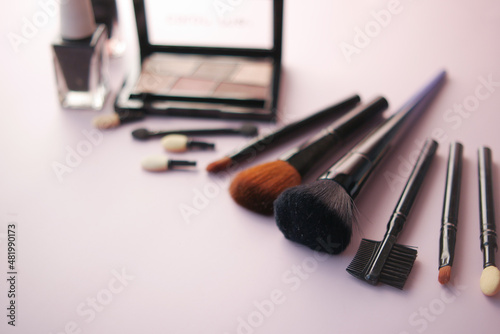 top view of decorative black color cosmetic on dark background 