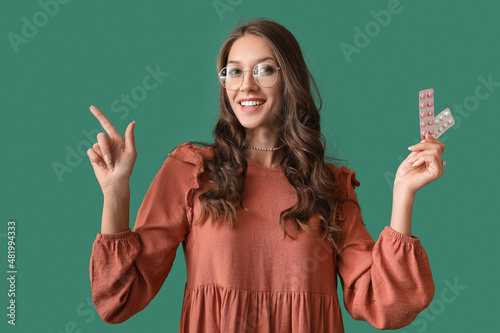 Young woman holding blister...