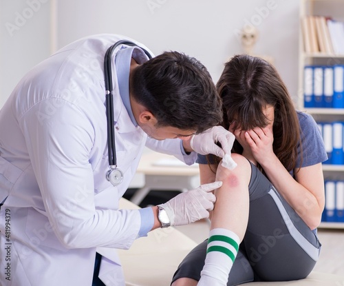 Patient visiting doctor after sustaining sports injury