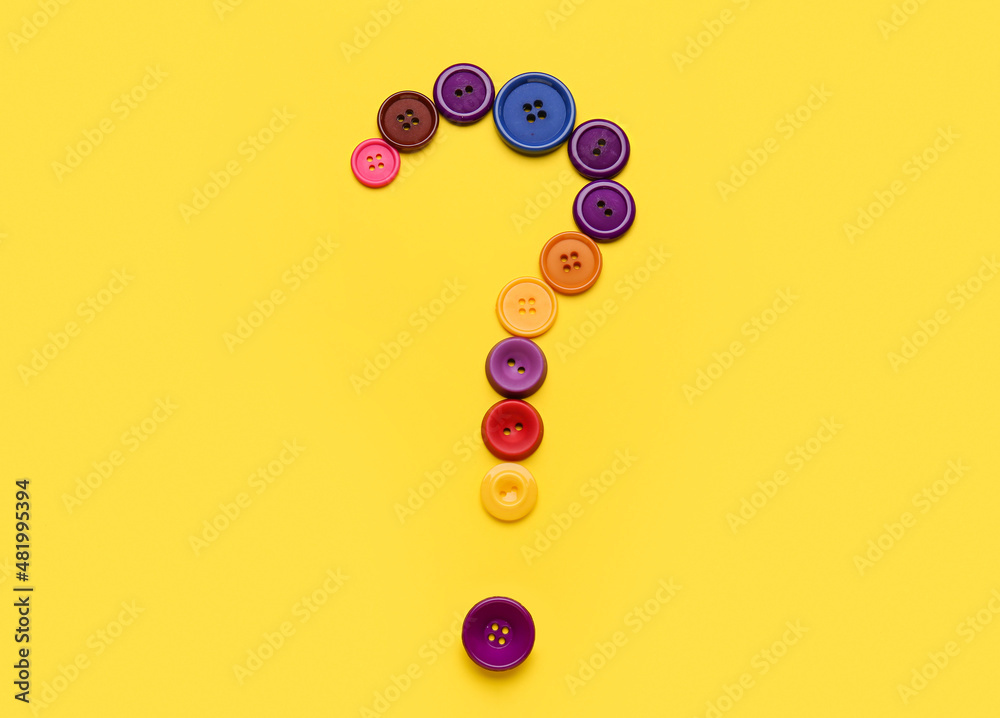 Question mark made of buttons on yellow background Question mark made of buttons on yellow background