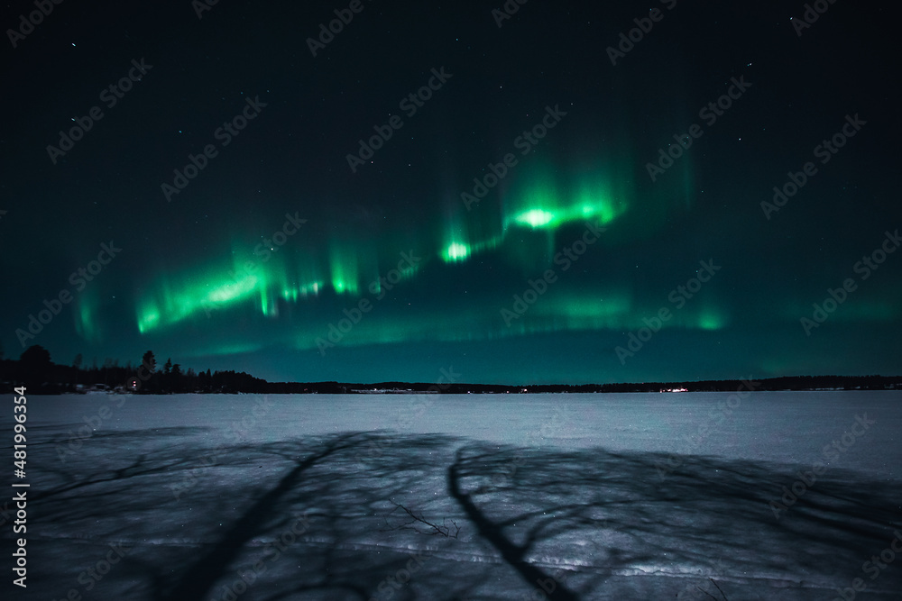 Northern Lights over an icy lake, Finland
